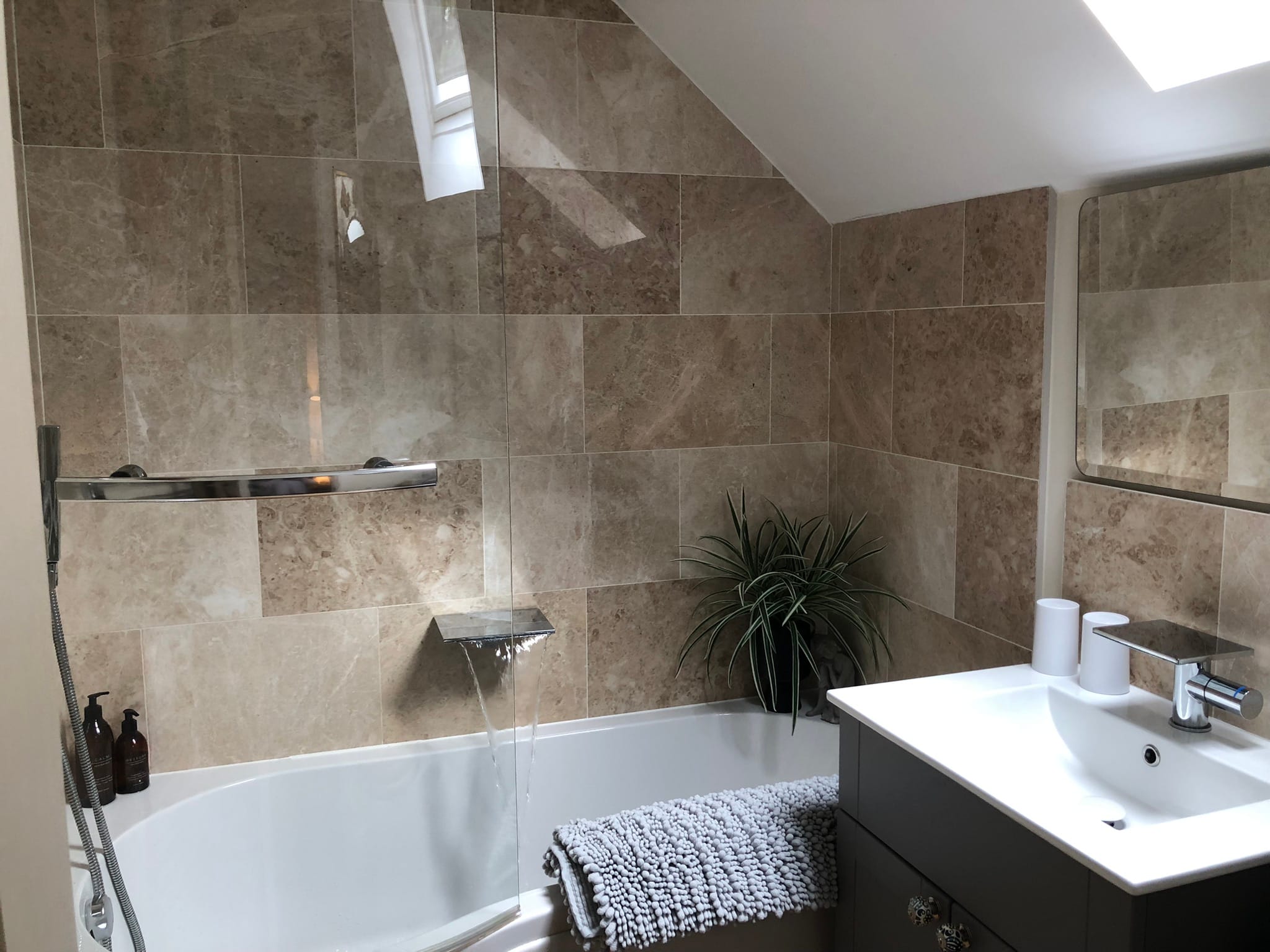 Bath with shower enclosure