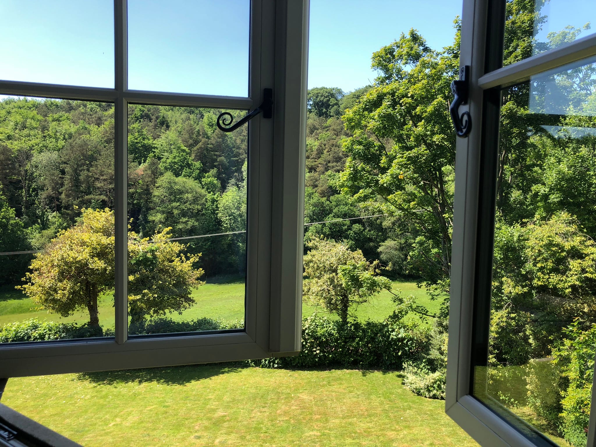 Self-Contained Holiday Cottage Accommodation In Sussex A view of the gardens out of the window of The Nest
