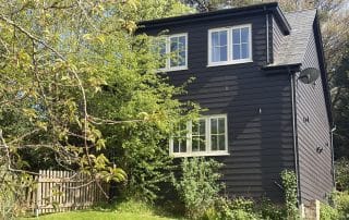 character weatherboarded cottage