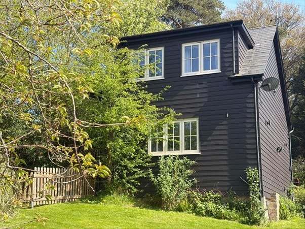 character weatherboarded cottage