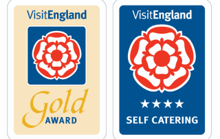 VisitEngland Gold Award and four-star self-catering badges