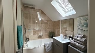 Self-Catering Holiday Cottage Accommodation In Sussex Modern bathroom at The Nest Danehill with bath, shower and skylight