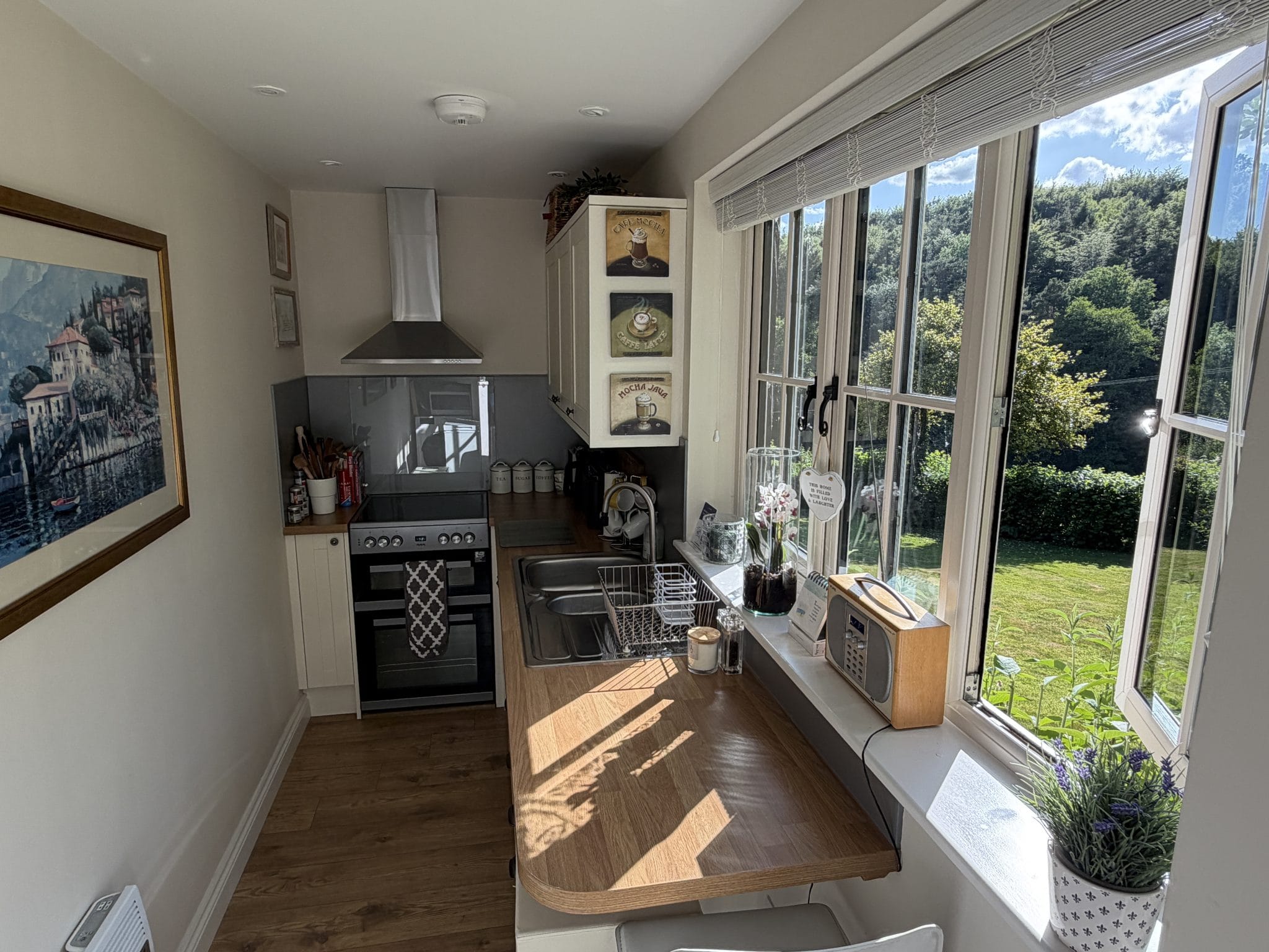 Self-Catering Holiday Cottage Accommodation In Sussex Fully equipped kitchen at The Nest Danehill overlooking the woodland garden