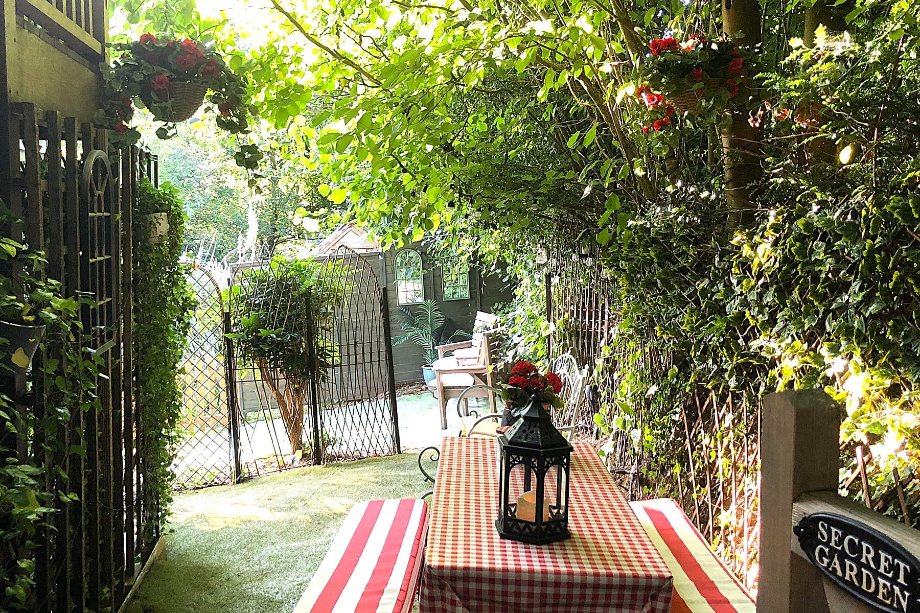 Self-Catering Holiday Cottage Accommodation In Sussex Secluded private garden at The Nest Danehill surrounded by greenery