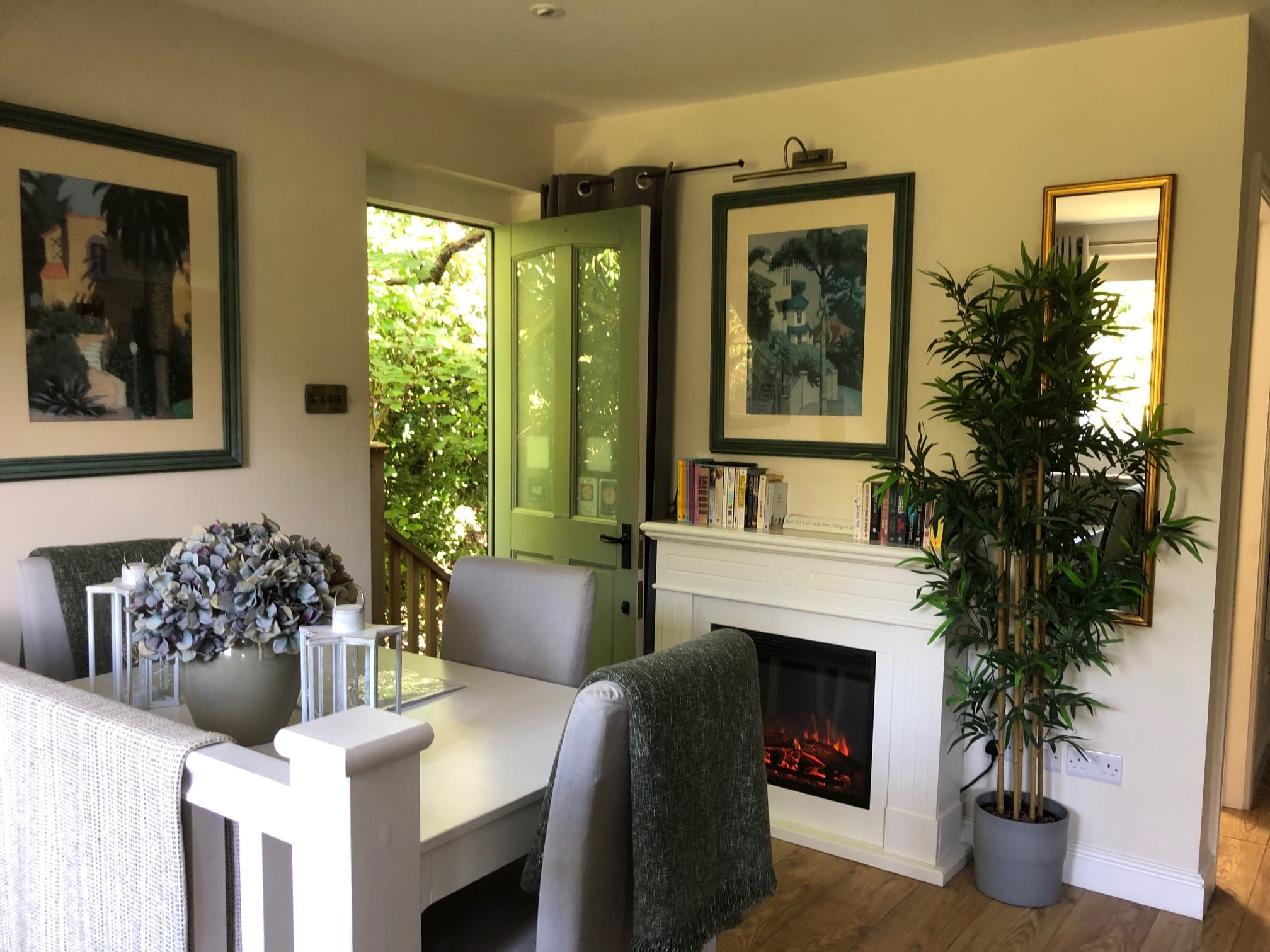 Self-Catering Holiday Cottage Accommodation In Sussex Cosy dining area with fireplace inside The Nest Danehill